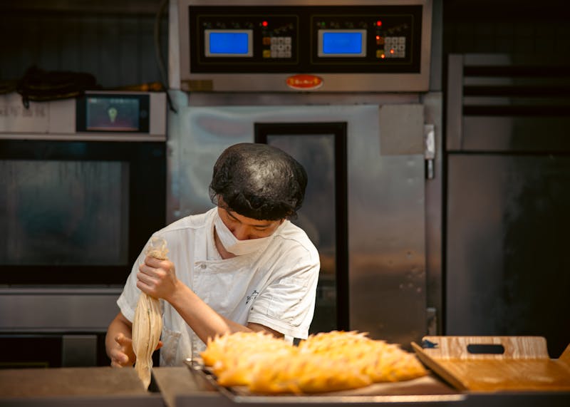 Pastry chef crafting desserts at Seasons pizza